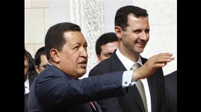 El presidente venezolano, Hugo Chávez, y su homólogo sirio, Bashar al-Assad